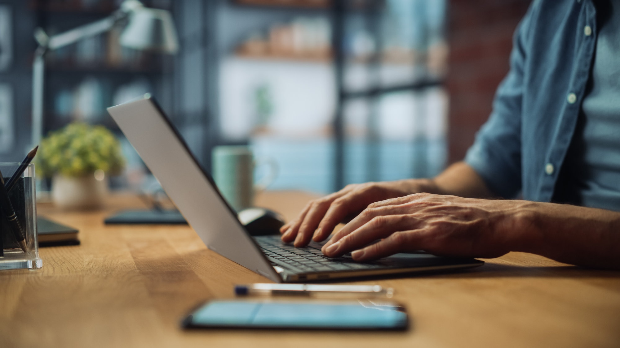 Laptop computer with individual donating cash to charity