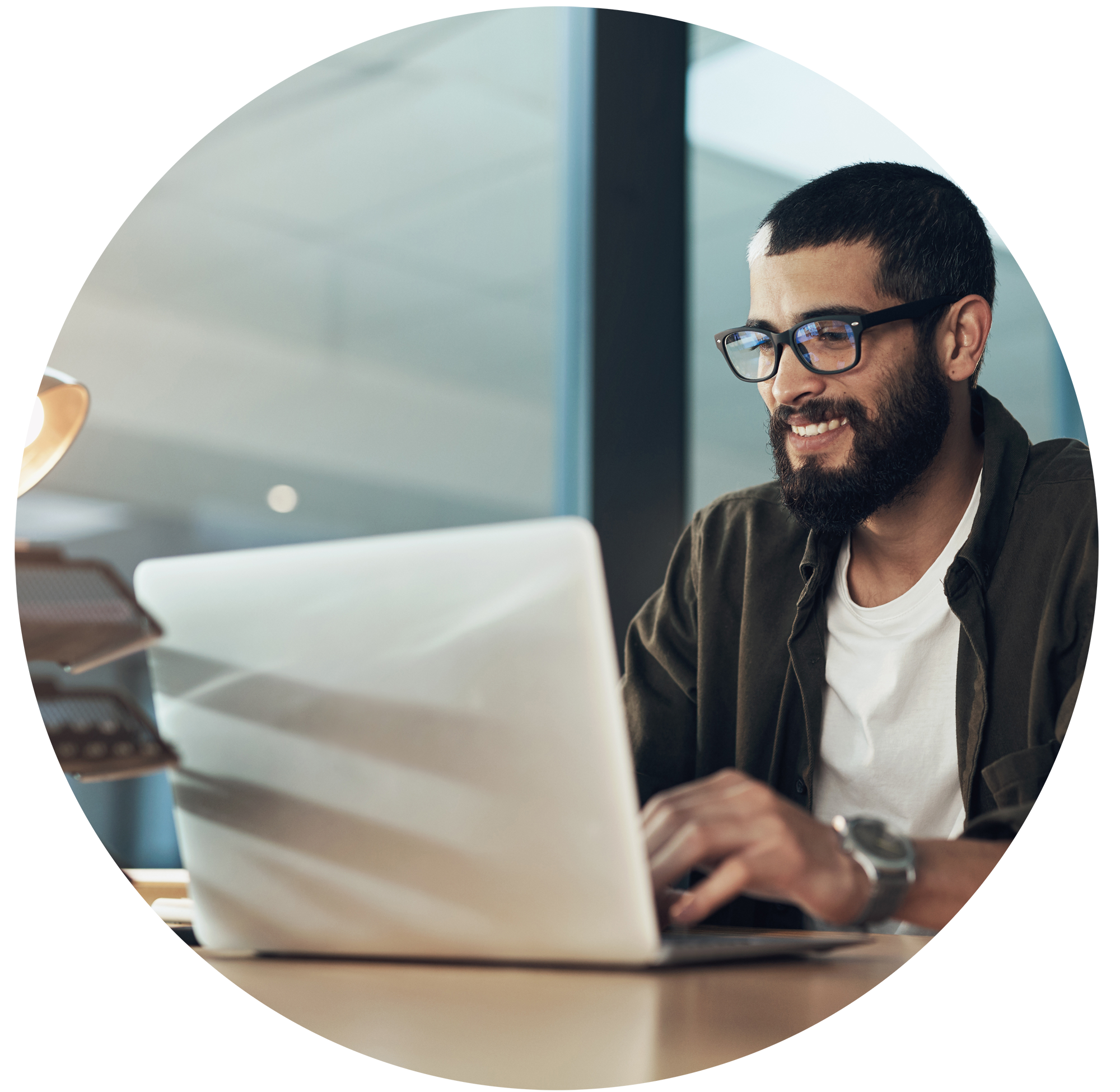 Man opening a Giving Account on his laptop and contributing long-term appreciated restricted stock