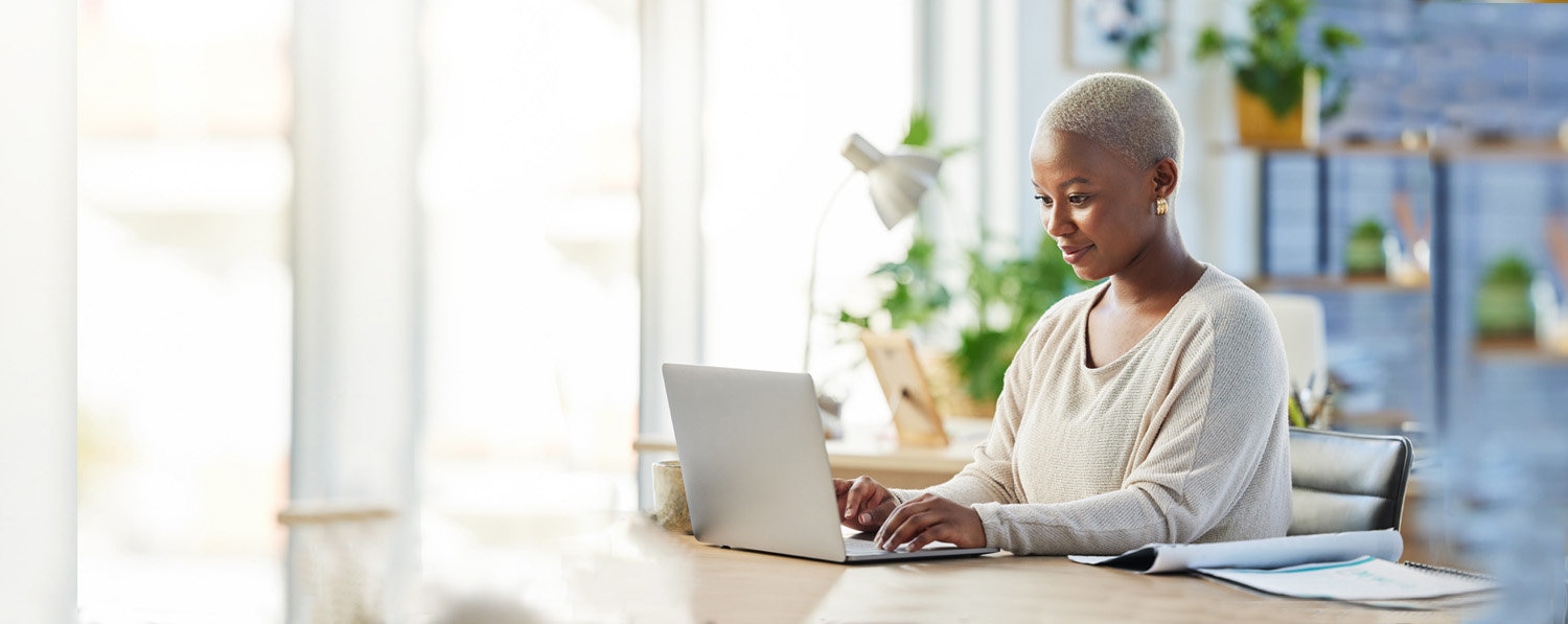 Woman working on laptop and opening Giving Account